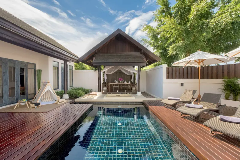 Private plunge pool with teak deck, loungers and a Thai-style pavilion at an Anantara Lawana pool villa
