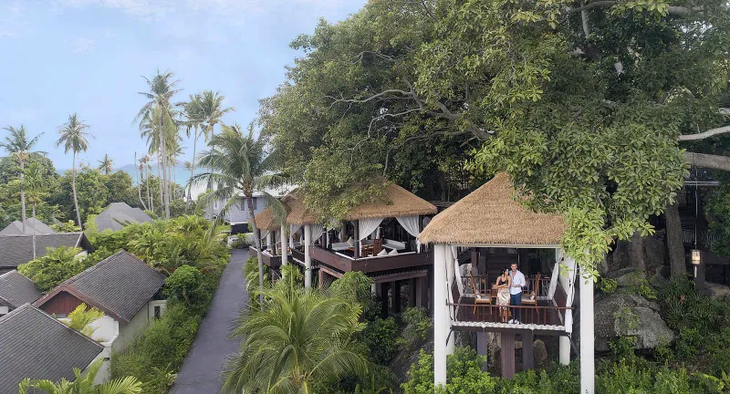 Timber dining pavilions among tree canopy at Tree Tops restaurant, Anantara Lawana Koh Samui