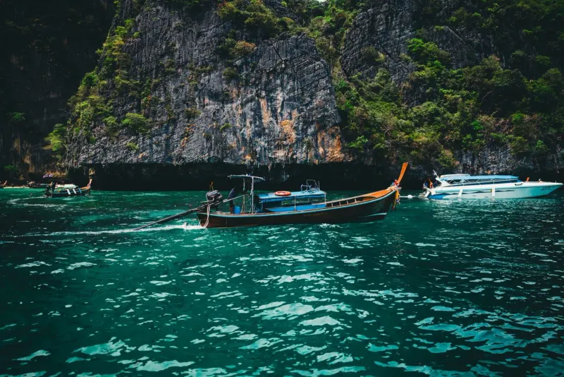Boat approaching Ang Thong Marine Park limestone islands, where marine protection is mostly regulatory