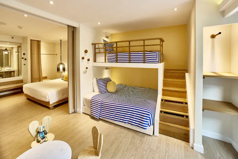 Family suite with bunk beds, stair storage and a separate double bedroom at Bandara Resort Samui