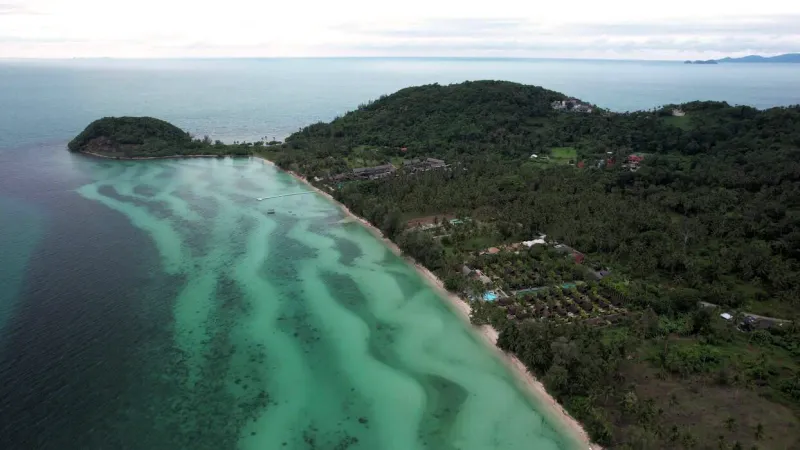 Aerial view of Bang Makham's tidal sand patterns along the Ring Road coastline