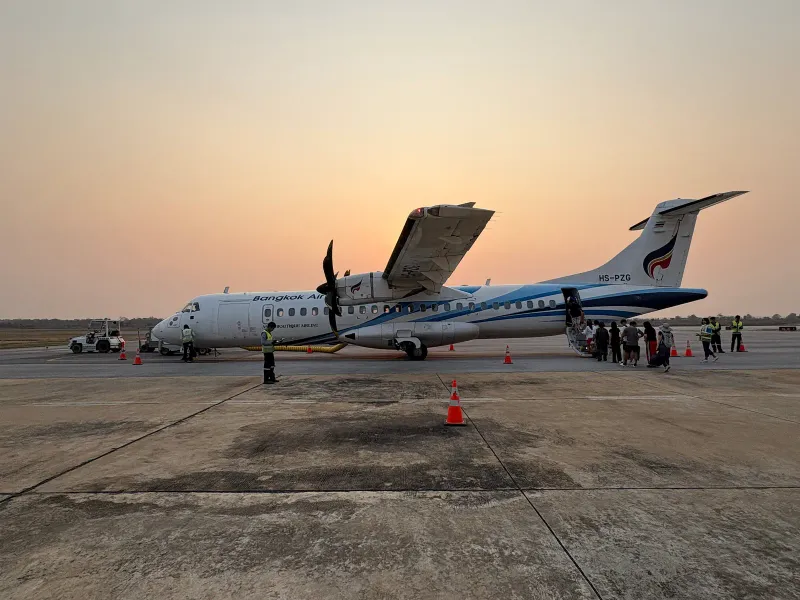 Bangkok Airways ATR 72-600 turboprop parked on the apron, the type used on short Thai routes