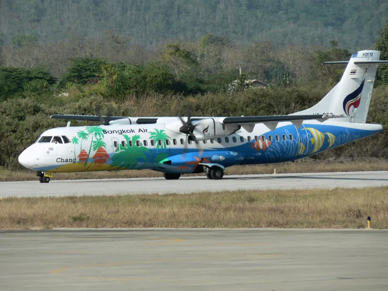 Bangkok Airways ATR 72 turboprop parked at a Southeast Asian airport