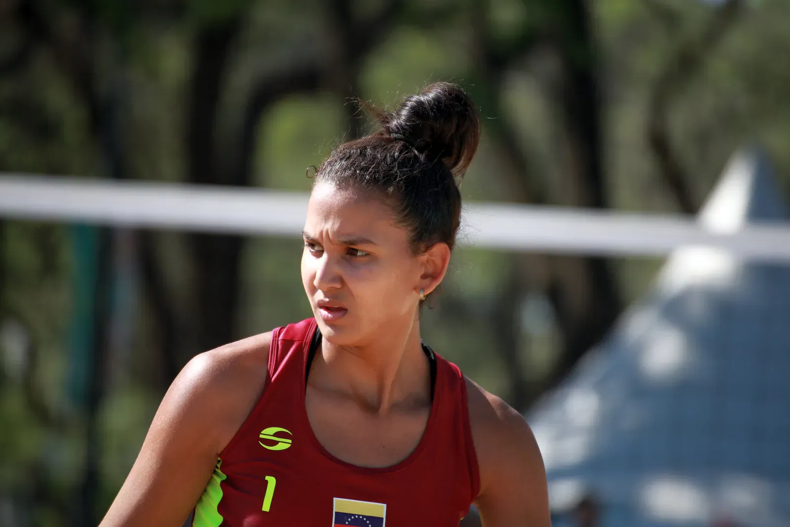 Beach volleyball player watching the ball during a match