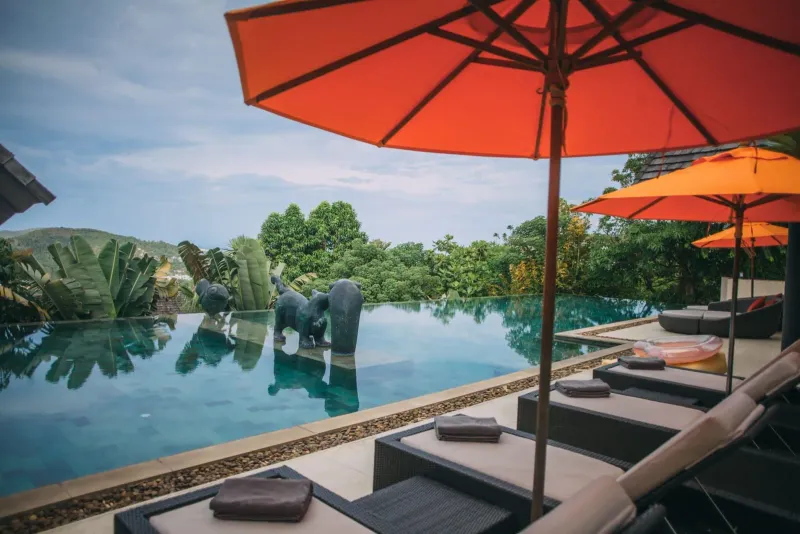 Poolside sun loungers at a Choeng Mon Koh Samui luxury resort