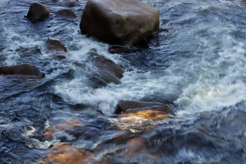 Boulder-strewn jungle stream typical of the rapids at Lat Wanon
