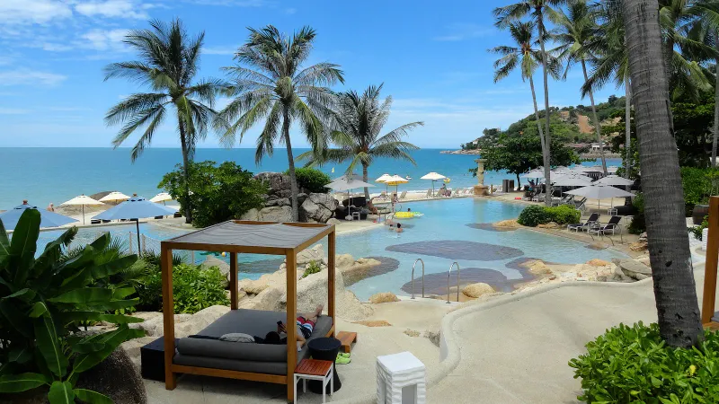 Long sandy stretch of Chaweng Beach on Koh Samui seen from the shore