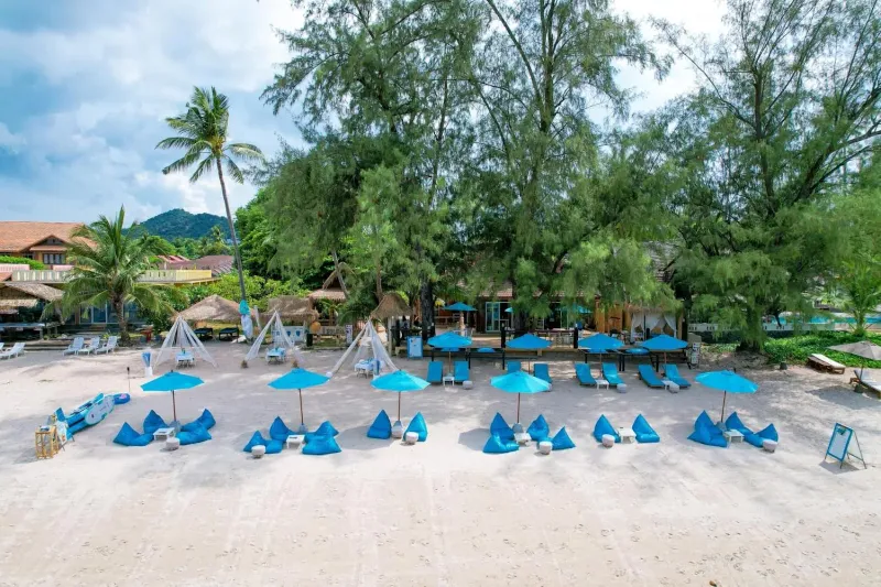 Beach club seating on the sand at Choeng Mon in the evening