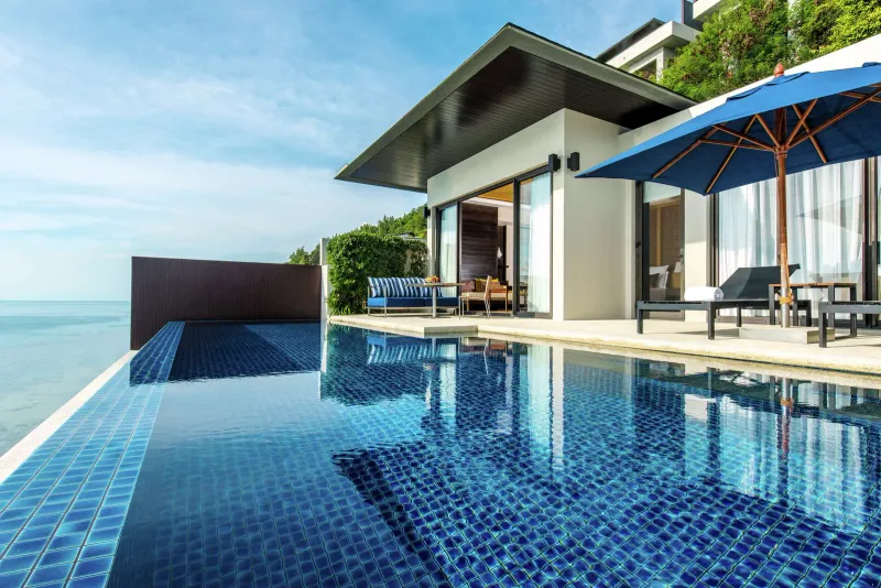 Conrad Koh Samui pool villa with a blue infinity pool, sun loungers and sea view, Taling Ngam