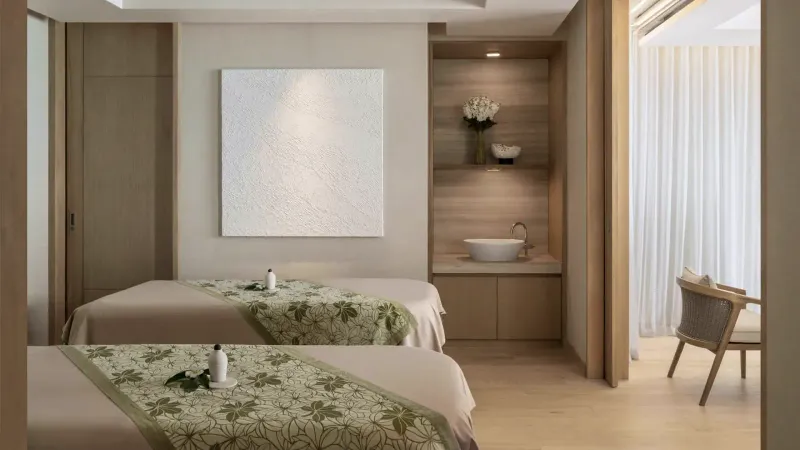 Twin treatment room with two massage beds at the Conrad Koh Samui spa