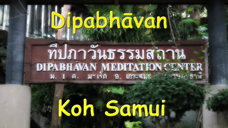 Wooden sign carved with the Dipabhavan Meditation Center name in Thai and English