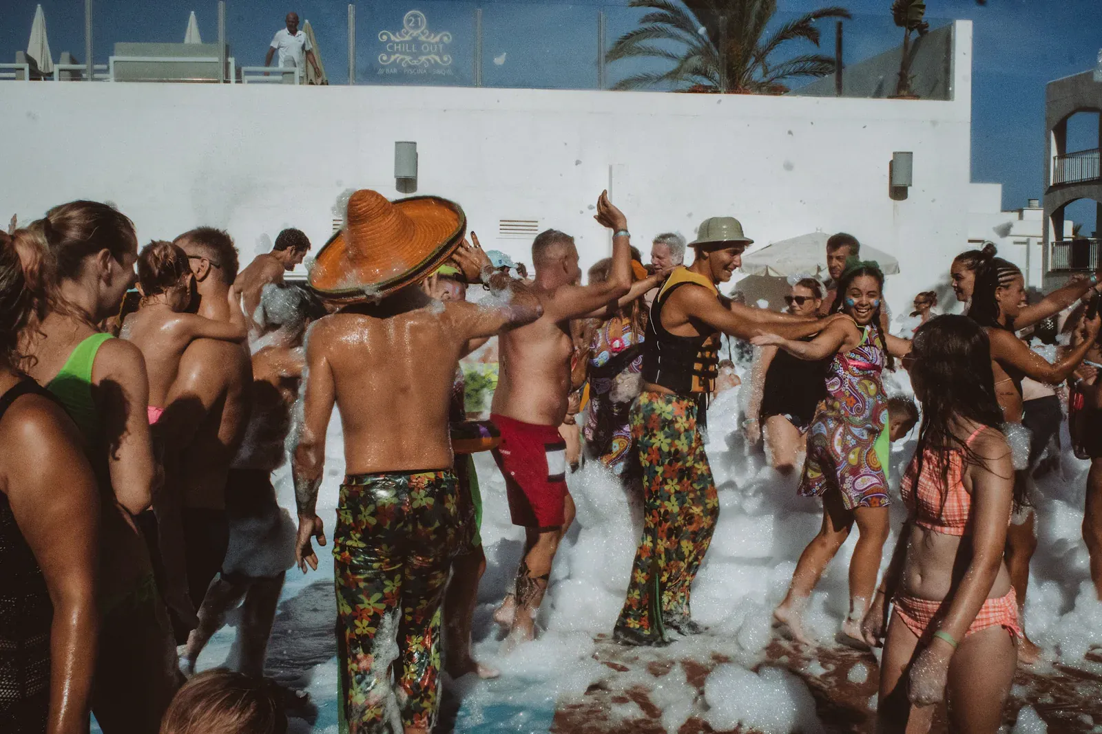 Crowd dancing in foam at a party