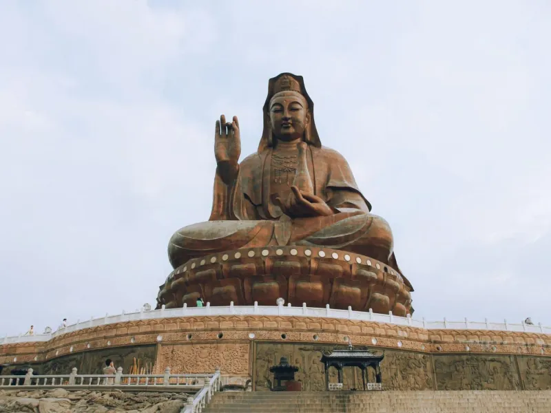 Low angle view of the Guanyin statue at Mount Xiqiao, a famous cultural and tourist landmark