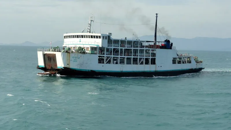 Raja car ferry with open vehicle deck and passenger decks sailing across the Gulf of Thailand