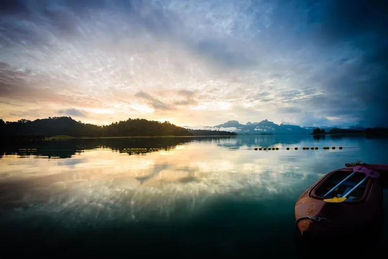 Sunrise over Cheow Lan Lake seen from a ranger station in Khao Sok National Park