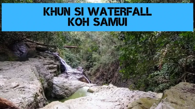 Khun Si Waterfall's cascade framed by dense jungle canopy
