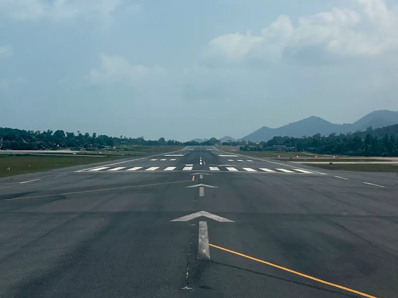Koh Samui Airport runway seen from the airport grounds in 2024