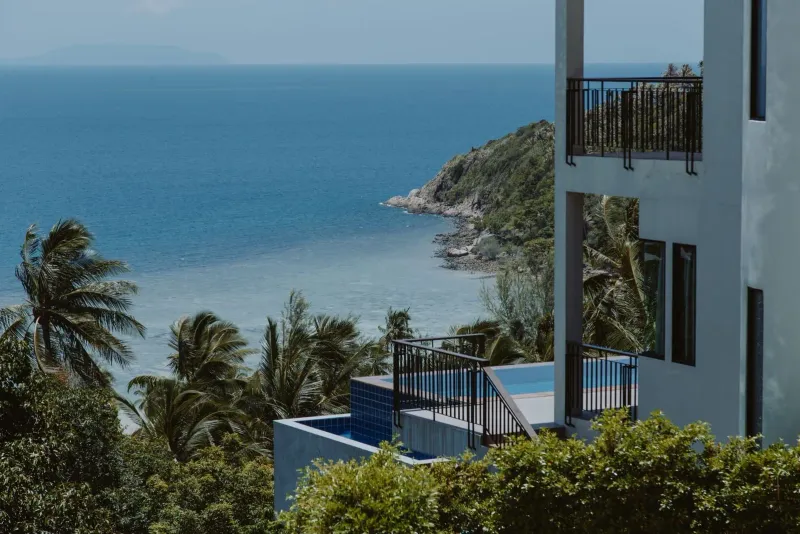 Simple rental apartment building on Koh Samui with balconies and shared stairwell