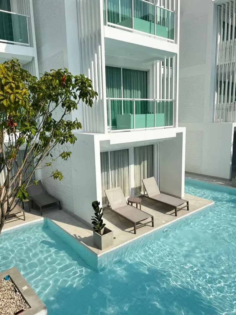 Modern Koh Samui condo with a poolside view, the kind of unit expats rent long term