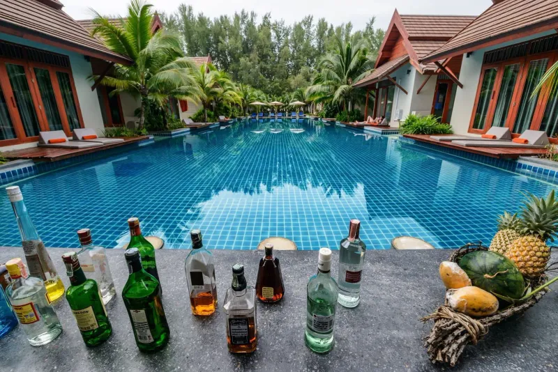 Poolside lounge area with tropical drinks at a Koh Samui couples resort