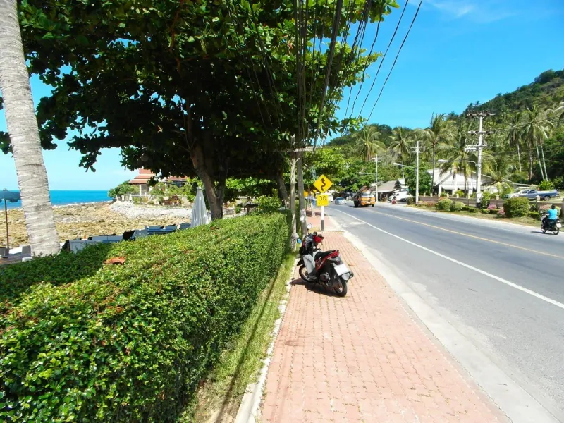 Tropical beach scene on Koh Samui with calm sea in the foreground
