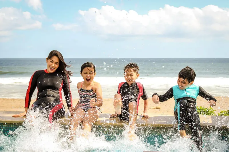Children splashing at the water's edge