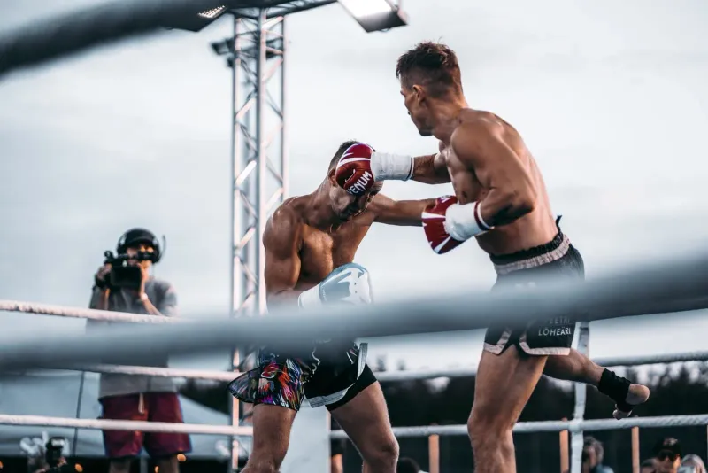 Muay thai fighter landing a strike in a Koh Samui stadium bout after months of training