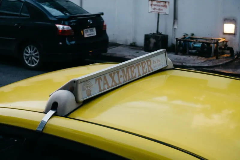 Close-up of a taxi meter sign, illustrating the metered fares that most Samui taxis skip