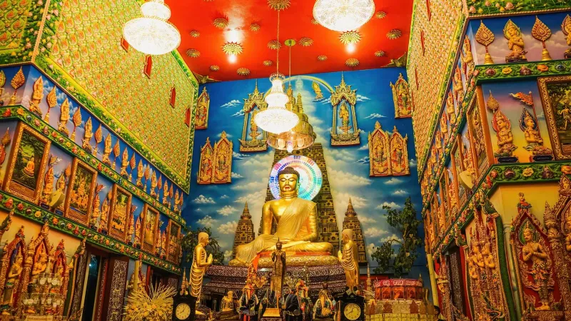 Golden Buddha statue at a Koh Samui temple courtyard