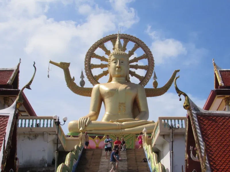 Golden Buddha statue at a Koh Samui temple, one of the island's cultural landmarks near Nathon