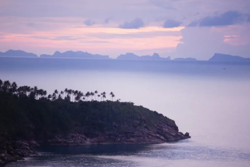 Purple sunset sky over Gulf of Thailand islands seen from a Koh Samui hillside viewpoint