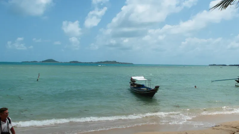 A longtail boat out on the water off Koh Tan