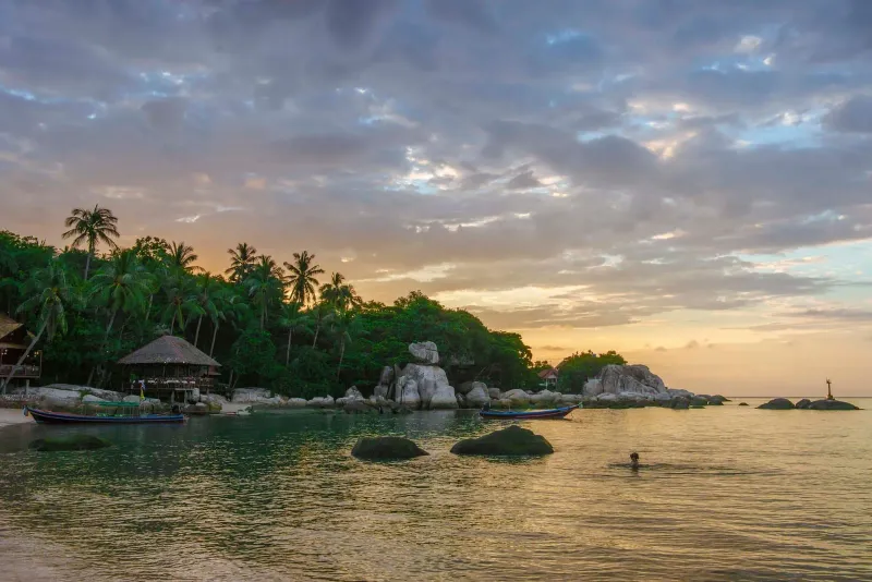 Rocky shoreline at sunset on Koh Tao, the smallest of the three Gulf islands
