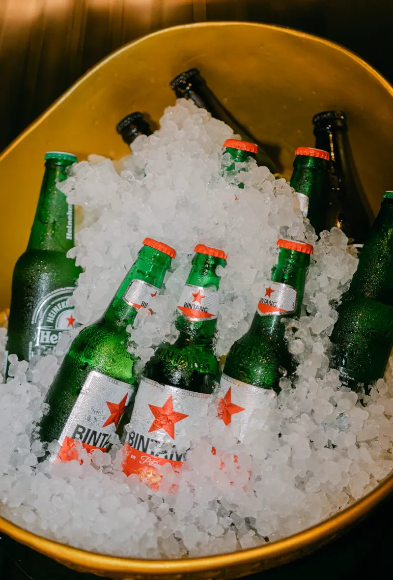 Bottles of beer on ice in a bucket
