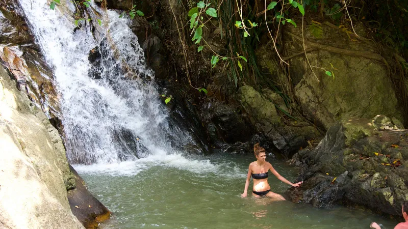 Na Muang 1 waterfall dropping into a natural swimming pool in the Koh Samui interior