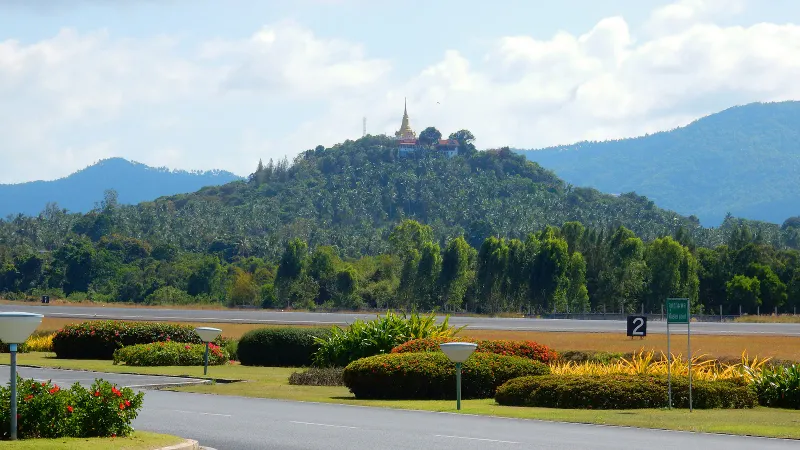 Departures area at Samui Airport with covered walkways and gardens, seen in 2015
