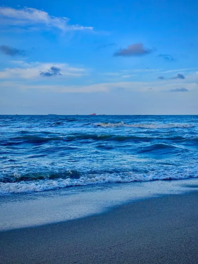 Gentle waves lapping a quiet sandy shoreline